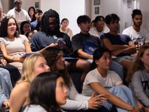 group of students sitting close together for debate watch party